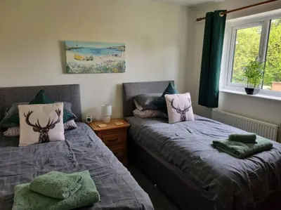 a bedroom with two beds and a window at 41 mortimer drive, ideal location near ludlow in Orleton