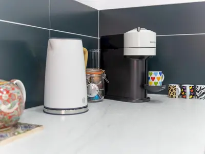 a coffee maker sitting on a counter next to a cup at The William Morris Lodge in the centre of Ludlow - Pass the Keys in Ludlow