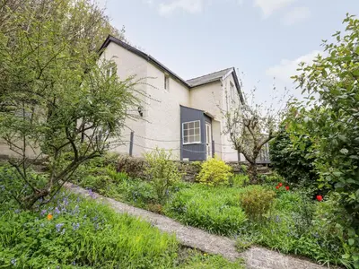a house with a garden in front of it at Myrtle Villa in Knighton
