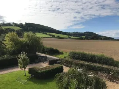 an aerial view of a field with a large field sidx sidx sidx at Ty Hobi Bach - at the foot of the Black Mountains in Brecon