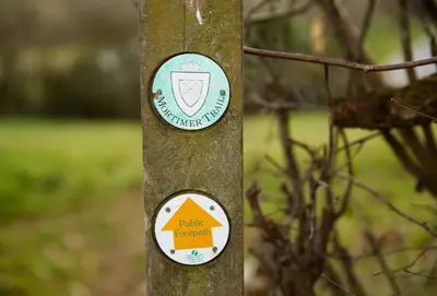 a pole with two signs on it at Upper Mowley in Kington