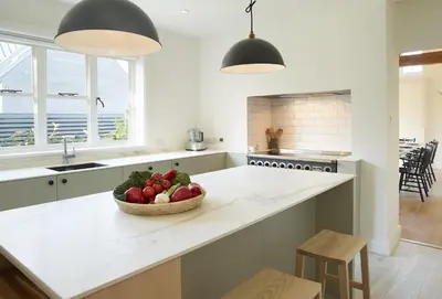 a kitchen with a bowl of fruit on a counter at Green Gables in Eardisley