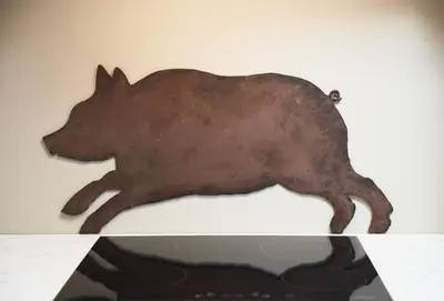a brown animal shaped like a dog on a wall at The Cart Shed Shropshire in Downton