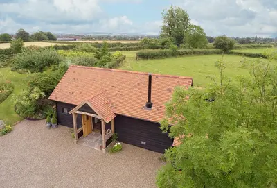 an overhead view of a small house in a field at Broomers Barn in Lane to Richards Castle