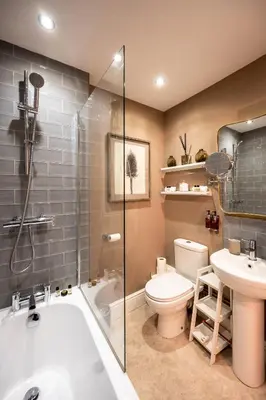 a bathroom with a tub and a toilet and a sink at At Home Apartments in Shrewsbury