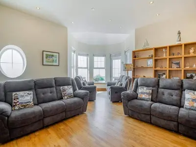 a living room with a couch and two couches at Rockcliffe in Aberdyfi