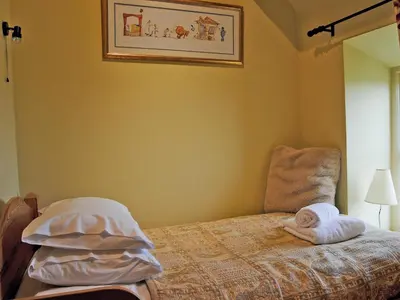 a bedroom with a bed with a towel on it at St Vincent in Plaish