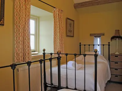 a bedroom with a bed and a window at St Vincent in Plaish
