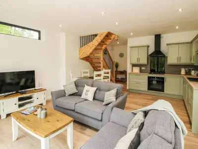 a living room with a couch and a table at The Larches in Bishops Castle