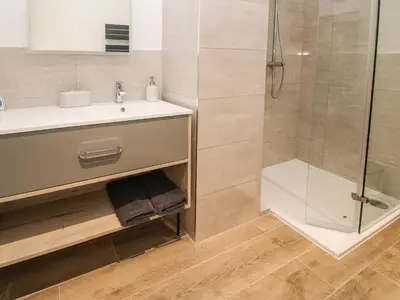 a bathroom with a shower and a sink at The Larches in Bishops Castle