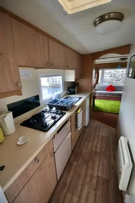 an rv kitchen with a stove and a sink at Ideal rural location for beaches, hills and town in Bow Street