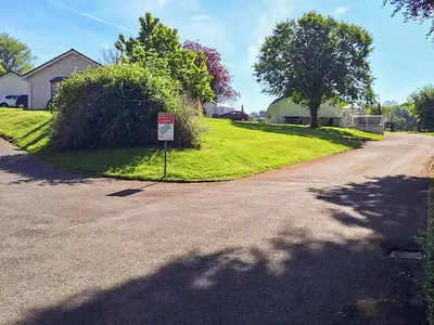 a street with a sign on the side of a road at Bwthyn Gwyn in Ciliau-Aeron