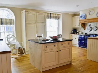 a kitchen with a island with a bowl on it at Awelfa - On7 in Aberaeron
