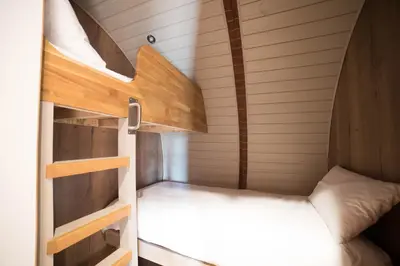 a small bedroom with a bunk bed in a tiny house at Foxes View in Rhayader