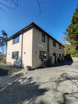 a large white building with a lot of windows at Bryn Mynach Guest House in Barmouth