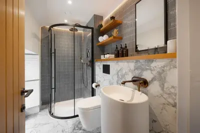 a bathroom with a sink and a shower at Hive Townhouse in Aberaeron