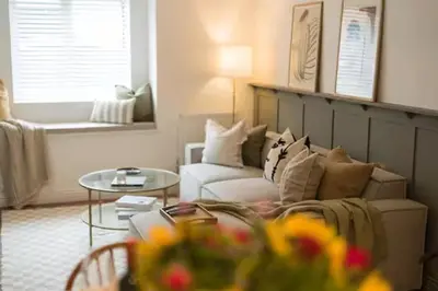 a living room with a couch and a table at Stylish, comfortable, convenient! in Bala