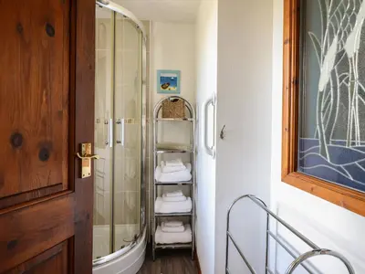 a bathroom with a shower and a glass door at Bodalaw in Trawsfynydd
