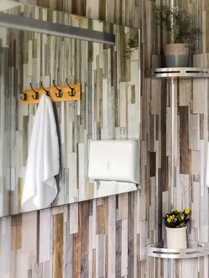 a bathroom with a mirror and a towel at Tinker the Bell Tent at Pentref Luxury Camping in Penuwch