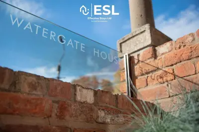 a brick wall with a street sign on it at 3 Bedroom House - Overlooking River - Shrewsbury Town Centre in Shrewsbury