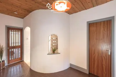 a hallway with white walls and a wooden door at 3 Bedroom House - Overlooking River - Shrewsbury Town Centre in Shrewsbury