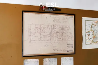 a map is hanging on a wall at 3 Bedroom House - Overlooking River - Shrewsbury Town Centre in Shrewsbury