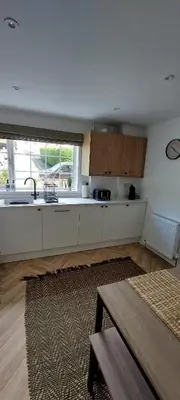 a kitchen with a sink and a counter top at Modern Town House in Mid Wales in Knighton