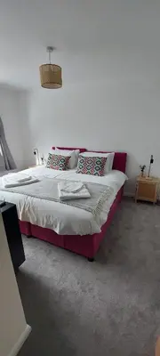 a bedroom with a large bed in a room at Modern Town House in Mid Wales in Knighton