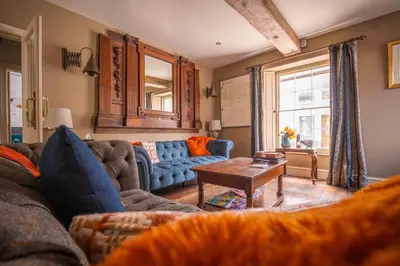 a living room with a couch and a table at The New White Lion in Llandovery