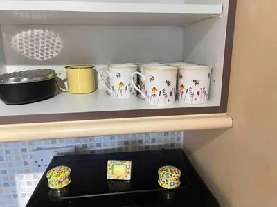 a shelf with four coffee mugs on it at Yew Tree Cottage, 3 bedroom, 4 Church Row Defynnog in Devynock