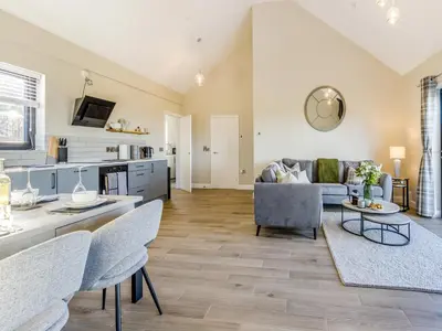 a living room with a couch and a table at The Warne - Uk45018 in Mochdre