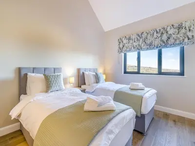 a bedroom with two beds and a window at The Warne - Uk45018 in Mochdre