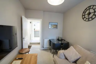 a living room with a couch and a table at Relaxing Town Centre House - Perfect for Exploring in Shrewsbury