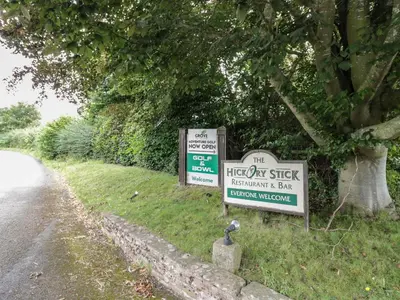 two signs on the side of a road at Grove Cottage in Leominster