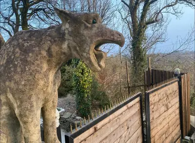 a statue of a giraffe with its mouth open at Coed Y Ddraig - themed 3 bedroom cottage, with bar & pool table in Tregaron