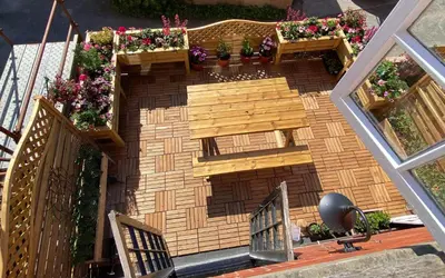 a model of a house with flowers on the stairs at Brooklands Guest House in Llandrindod Wells