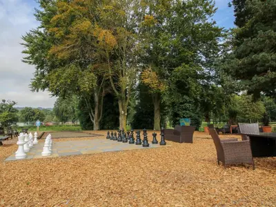 a large chessboard in the middle of a park at Heron in Leominster