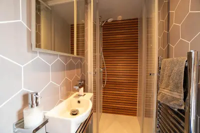 a bathroom with a sink and a shower at Beautiful cabins in Herefordshire countryside in Hereford