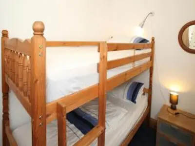 a couple of bunk beds in a room at Stargazing lodge with amazing views. in Llandrindod Wells