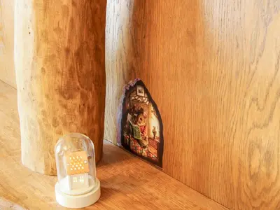 a small clock sitting on top of a wooden table at Shire's End in Caynham
