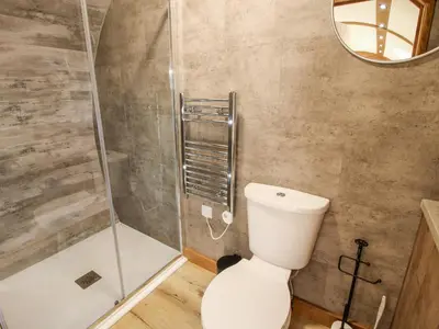 a bathroom with a toilet and a shower at Shire's End in Caynham