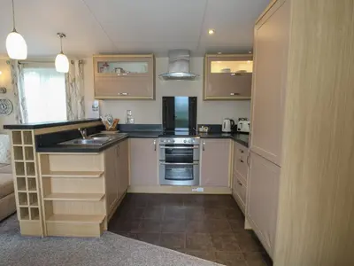 a kitchen with a sink and a stove at Dove in Leominster