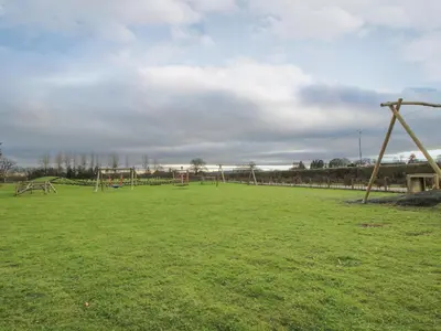 an empty park with a bunch of playground equipment at Dove in Leominster