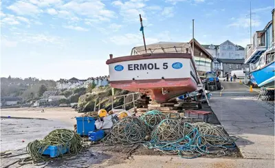 a boat sitting on top of a pile of ropes at No.1 Sail House in New Quay