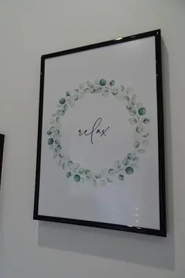 a framed picture of a plate on a wall at The Old Coach House in Llangollen