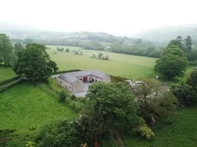 an aerial view of a house in a field at Peregrine Stable Cottage in Llandovery