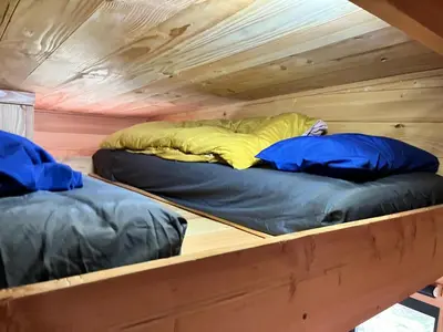two bunk beds in a tiny house at Beaver Tail Cabin in Hereford