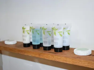 a shelf with a bunch of products on it at Cartws Blaenparc Coach House - Uk41031 in Mydroilin