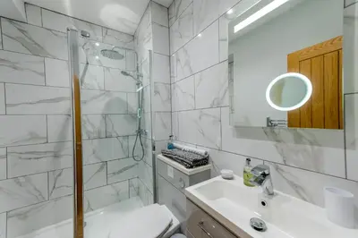 a bathroom with a shower and a toilet and a sink at 5B One bedrom Central Modern Apartment - Pass the Keys in Shrewsbury