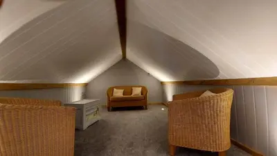 a room with two chairs and a table in a tent at No 1 Dolheulog Aberaeron SA46 0EP in Aberaeron